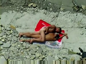 2 couples on the Beach filmed by a voyeur