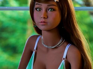 Pretty Asian sex doll presents steamy masturbation in her bed